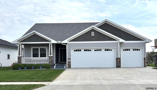 221 Briarwood Ln, Seward, NE 68434 - craftsman house with stone siding, driveway, an attached garage, and covered porch