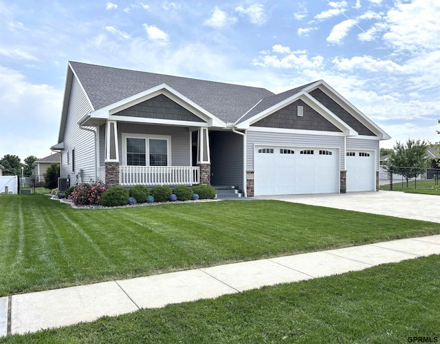 221 Briarwood Ln, Seward, NE 68434 - craftsman house featuring a porch, an attached garage, stone siding, driveway, and cooling unit