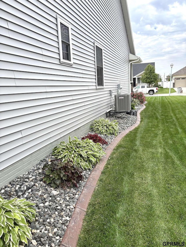 221 Briarwood Ln, Seward, NE 68434 - view of property exterior featuring cooling unit and a yard