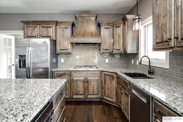 1809 S 220th Ave, Omaha, NE 68022 - kitchen featuring appliances with stainless steel finishes, custom range hood, dark wood finished floors, and light stone counters