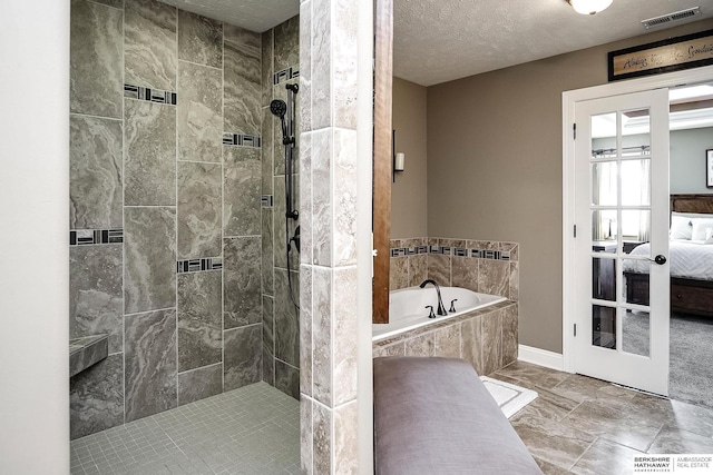 1809 S 220th Ave, Omaha, NE 68022 - ensuite bathroom with a garden tub, a shower stall, and a textured ceiling