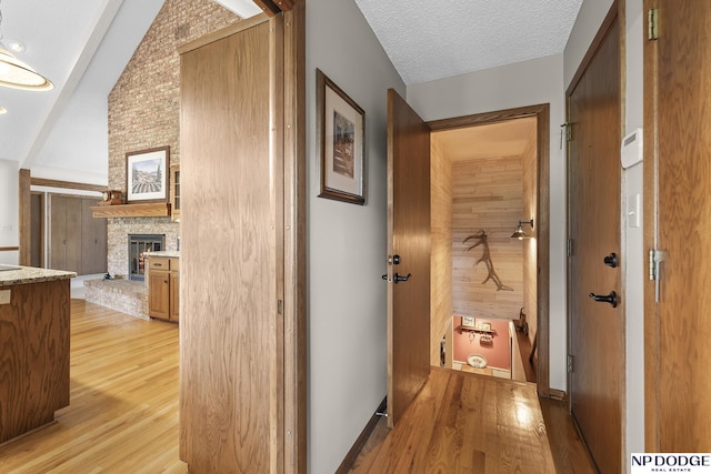 2723 Eagle Dr, Fremont, NE 68028 - hall with light wood-style flooring and vaulted ceiling