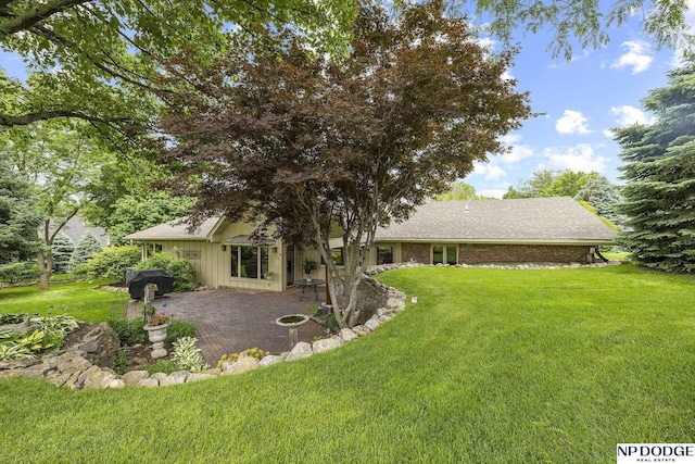 2723 Eagle Dr, Fremont, NE 68028 - view of grassy yard featuring a patio area