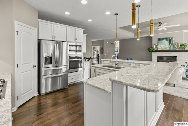 15301 Kansas Ave, Omaha, NE 68116 - kitchen featuring stainless steel appliances, a sink, dark wood-style floors, a ceiling fan, and recessed lighting