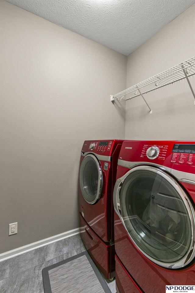 15301 Kansas Ave, Omaha, NE 68116 - washroom with washer and dryer, carpet floors, and baseboards