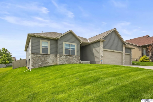 15301 Kansas Ave, Omaha, NE 68116 - view of front facade featuring a garage, stone siding, a front lawn, driveway, and roof with shingles
