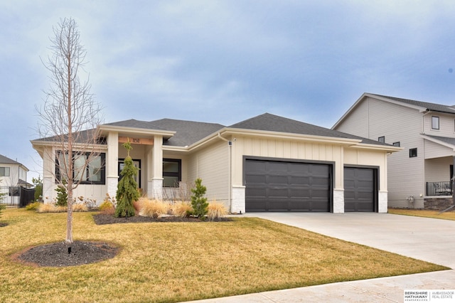 11511 S 190th St, Gretna, NE 68028 - prairie-style house with a garage, concrete driveway, a front yard, board and batten siding, and a porch