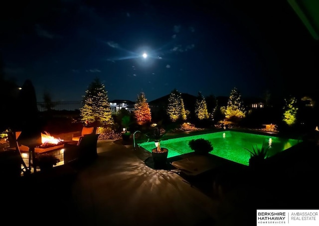 11511 S 190th St, Gretna, NE 68028 - pool at night with a fire pit and a patio area