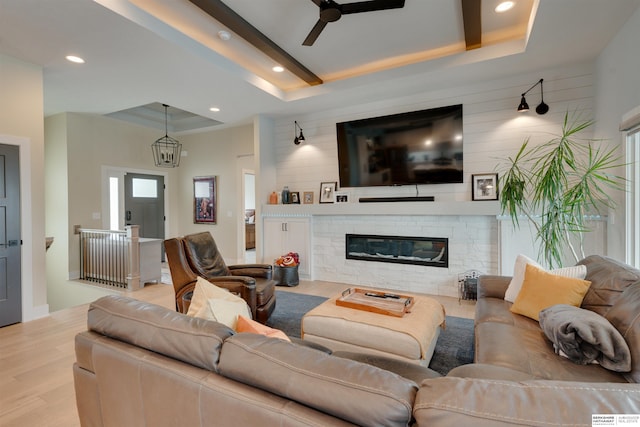 11511 S 190th St, Gretna, NE 68028 - living room with wood finished floors, ceiling fan, a raised ceiling, recessed lighting, and a fireplace
