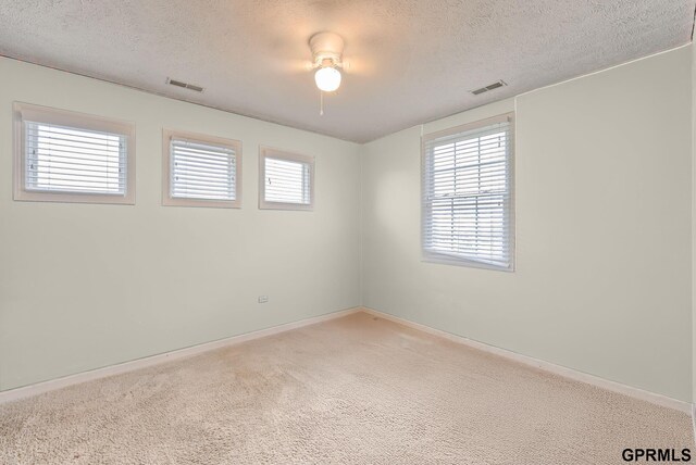 18063 Jones St, Elkhorn, NE 68022 - unfurnished room with a textured ceiling, carpet, and baseboards