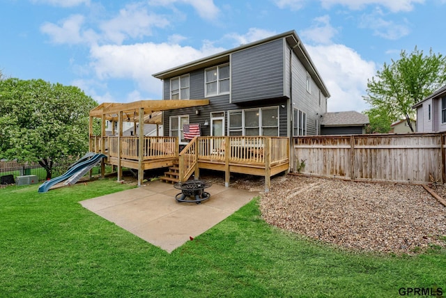 18063 Jones St, Elkhorn, NE 68022 - rear view of house featuring a wooden deck, a patio area, an outdoor fire pit, a playground, and a pergola