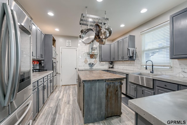 18063 Jones St, Elkhorn, NE 68022 - kitchen featuring appliances with stainless steel finishes, gray cabinets, wooden counters, a sink, and recessed lighting
