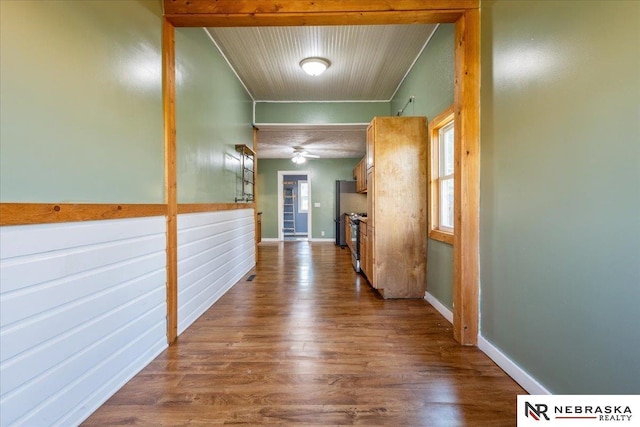 610 S 10th St, Plattsmouth, NE 68048 - corridor featuring dark wood-type flooring, healthy amount of natural light, baseboards, and wood ceiling