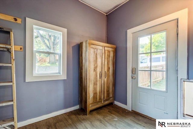 610 S 10th St, Plattsmouth, NE 68048 - doorway to outside with wood finished floors, plenty of natural light, baseboards, and ornamental molding