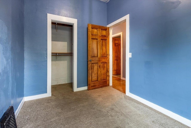 610 S 10th St, Plattsmouth, NE 68048 - unfurnished bedroom with carpet floors, a closet, and baseboards