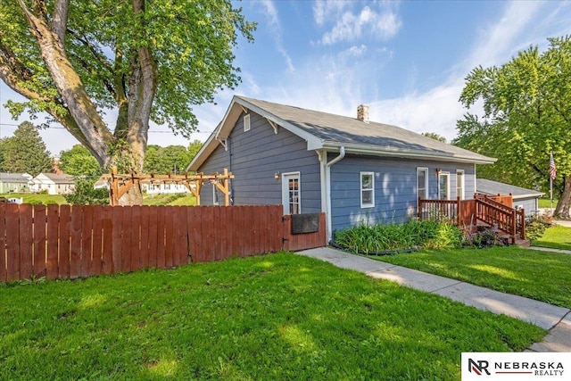 610 S 10th St, Plattsmouth, NE 68048 - view of home's exterior featuring a chimney