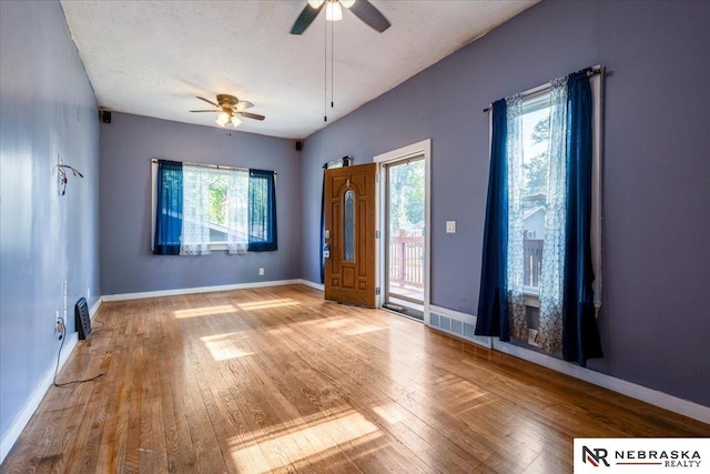 610 S 10th St, Plattsmouth, NE 68048 - unfurnished room with a ceiling fan, hardwood / wood-style floors, and baseboards