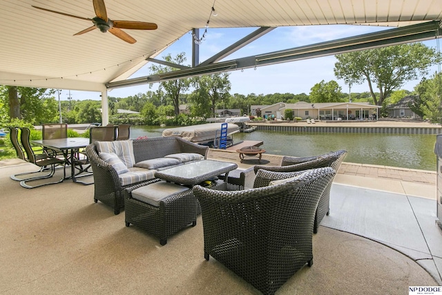 S-44 Poehling Ln, Fremont, NE 68025 - view of patio with a water view and a ceiling fan
