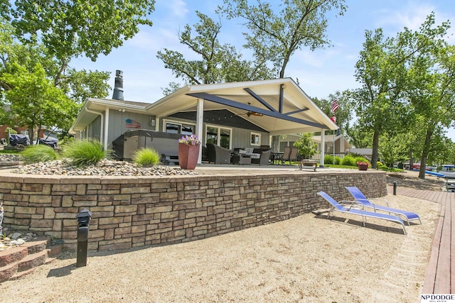 S-44 Poehling Ln, Fremont, NE 68025 - back of house with a patio, outdoor lounge area, and a chimney
