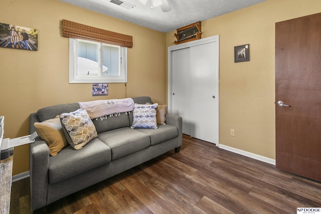 S-44 Poehling Ln, Fremont, NE 68025 - living room featuring dark wood-type flooring, ceiling fan, and baseboards
