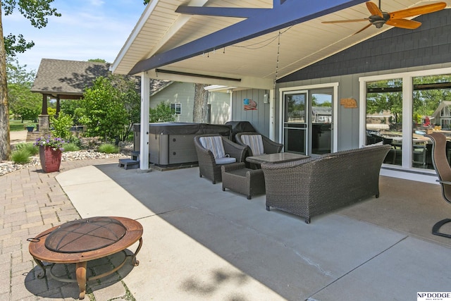 S-44 Poehling Ln, Fremont, NE 68025 - view of patio / terrace featuring a hot tub and a ceiling fan