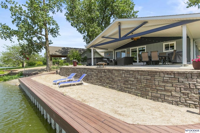 S-44 Poehling Ln, Fremont, NE 68025 - wooden terrace with a patio area and a water view