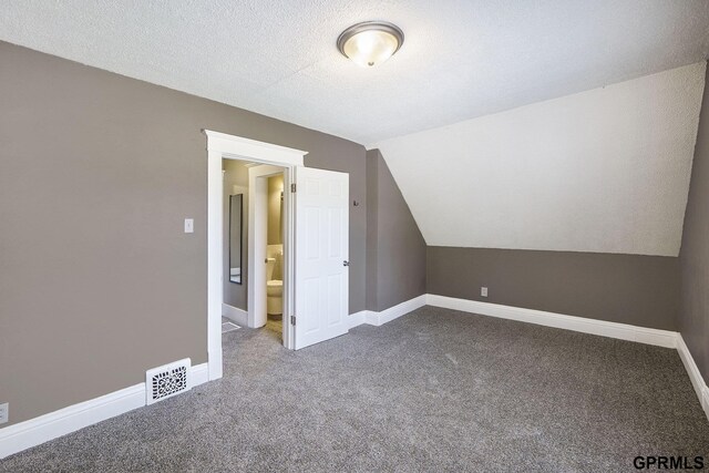 2945 N 59th St, Omaha, NE 68104 - bonus room with carpet, lofted ceiling, and baseboards