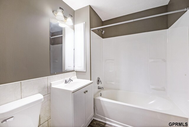 2945 N 59th St, Omaha, NE 68104 - full bathroom featuring toilet, vanity, and bathing tub / shower combination