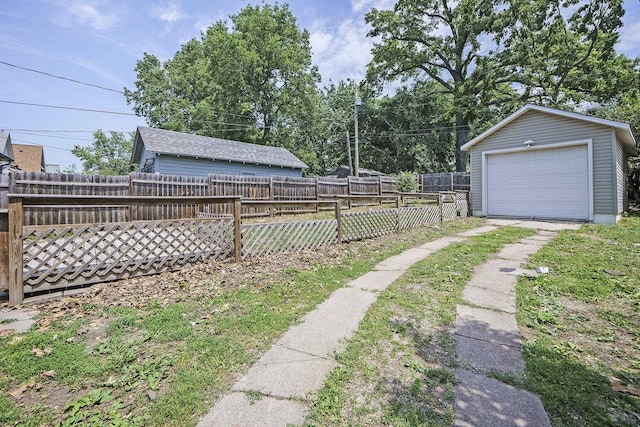 2945 N 59th St, Omaha, NE 68104 - fenced yard with driveway, a garage, and an outdoor structure