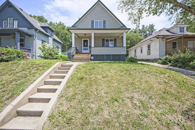 2945 N 59th St, Omaha, NE 68104 - view of front of home featuring a porch and a front lawn