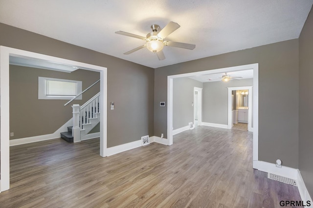 2945 N 59th St, Omaha, NE 68104 - spare room with ceiling fan, light wood-style floors, and baseboards