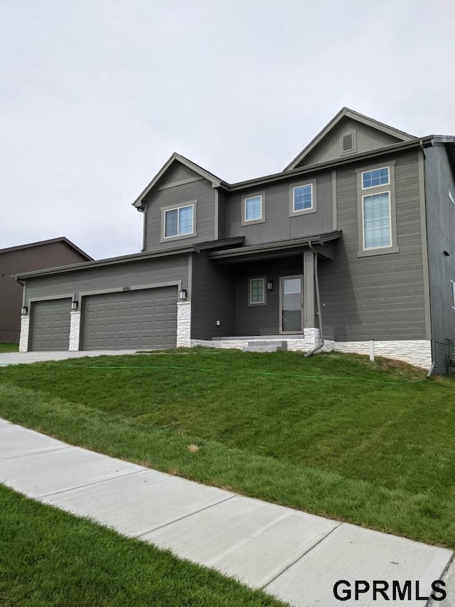 14316 S 19th Cir, Bellevue, NE 68123 - view of front of property with a front yard, driveway, and an attached garage