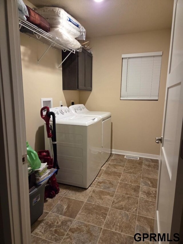 14316 S 19th Cir, Bellevue, NE 68123 - laundry room with washing machine and dryer, cabinet space, and baseboards