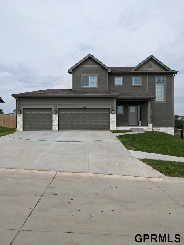14316 S 19th Cir, Bellevue, NE 68123 - view of front of home with driveway and a garage