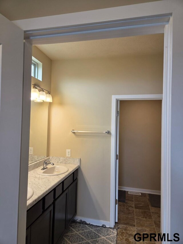14316 S 19th Cir, Bellevue, NE 68123 - bathroom with double vanity and baseboards