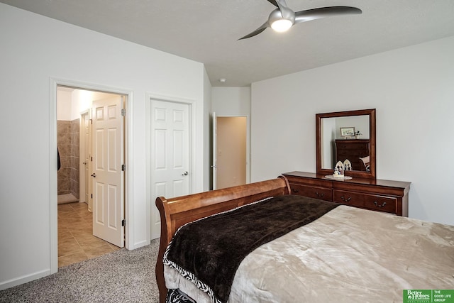 2627 N 166th St, Omaha, NE 68116 - bedroom with light carpet, light tile patterned floors, connected bathroom, and a ceiling fan