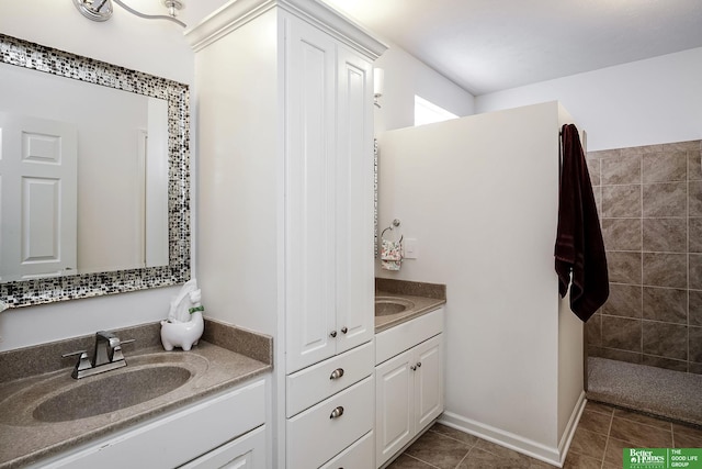 2627 N 166th St, Omaha, NE 68116 - bathroom featuring vanity, tile patterned floors, and tiled shower