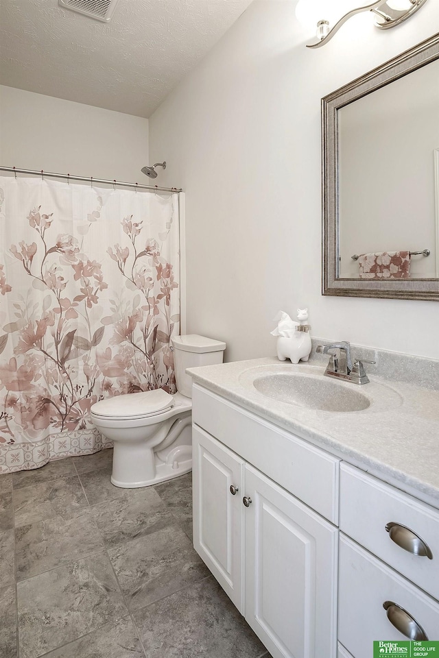 2627 N 166th St, Omaha, NE 68116 - full bathroom with vanity, toilet, a shower with curtain, and a textured ceiling