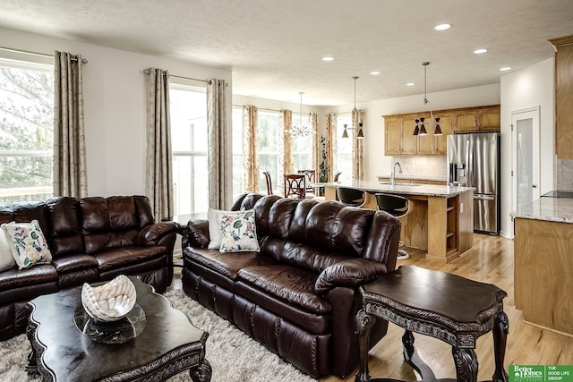 2627 N 166th St, Omaha, NE 68116 - living room with light wood finished floors and recessed lighting