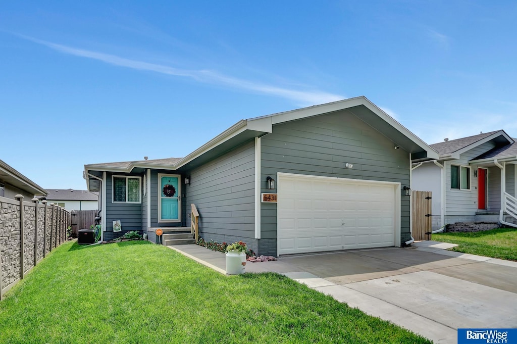 5431 W Partridge Ln, Lincoln, NE 68528 - ranch-style home featuring an attached garage and driveway