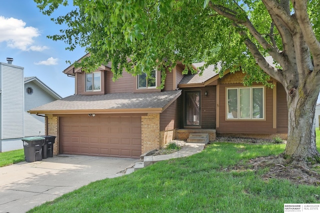 12335 Wirt St, Omaha, NE 68164 - tri-level home featuring concrete driveway, a shingled roof, a garage, a front yard, and brick siding