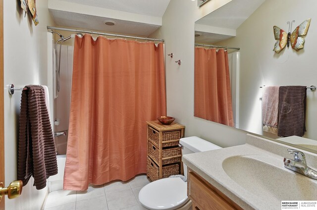 12335 Wirt St, Omaha, NE 68164 - bathroom featuring toilet, vanity, tile patterned floors, and shower / bath combination with curtain