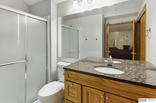 12335 Wirt St, Omaha, NE 68164 - bathroom with a shower stall, vanity, and toilet