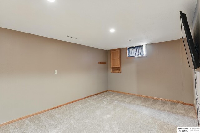 12335 Wirt St, Omaha, NE 68164 - below grade area with light carpet, baseboards, and recessed lighting