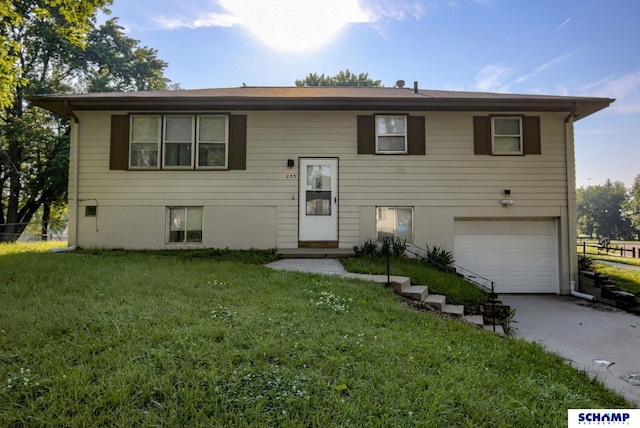 253 S 110th St, Omaha, NE 68154 - bi-level home featuring a garage and concrete driveway