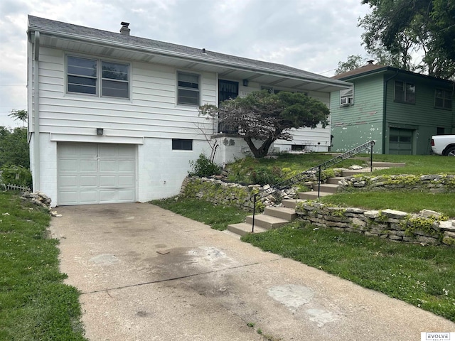 5329 N 47th St, Omaha, NE 68104 - view of front facade with a garage and driveway