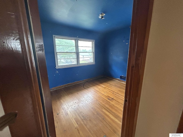 5329 N 47th St, Omaha, NE 68104 - empty room with hardwood / wood-style flooring and baseboards
