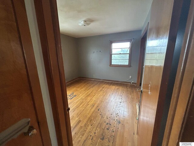 5329 N 47th St, Omaha, NE 68104 - unfurnished bedroom featuring light wood-style flooring and baseboards