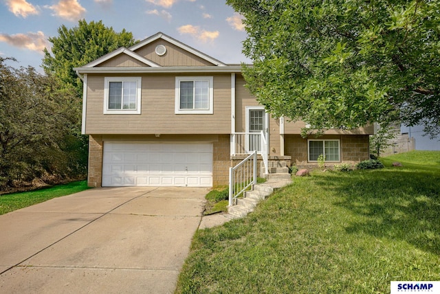 17103 Taylor St, Omaha, NE 68116 - bi-level home featuring an attached garage, concrete driveway, and a front lawn
