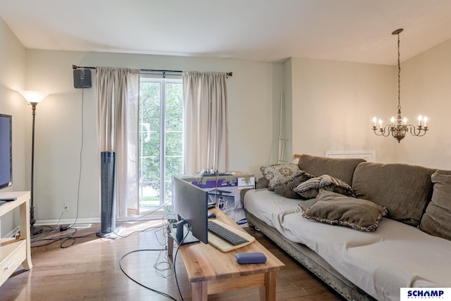 17103 Taylor St, Omaha, NE 68116 - living room with a chandelier, wood finished floors, healthy amount of natural light, and baseboards